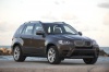 2013 BMW X5 xDrive50i in Sparkling Bronze Metallic from a front right view